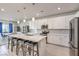 Modern kitchen featuring white cabinets, stainless steel appliances, and an island at 4390 E Cactus Canyon Dr, Pahrump, NV 89061