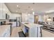 Modern kitchen with white cabinets and stainless steel appliances at 4390 E Cactus Canyon Dr, Pahrump, NV 89061