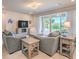 Living room with gray sofas, wooden coffee table, and sliding glass doors at 4390 E Cactus Canyon Dr, Pahrump, NV 89061