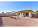 Sun-drenched backyard with covered patio and neatly landscaped area at 4435 Lavender Ln, Pahrump, NV 89061