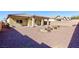 Large backyard, featuring a covered patio and drought-tolerant landscaping at 4435 Lavender Ln, Pahrump, NV 89061