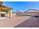 Spacious backyard with covered patio and gravel landscaping at 4435 Lavender Ln, Pahrump, NV 89061