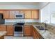 Kitchen with stainless steel appliances and granite countertops at 4435 Lavender Ln, Pahrump, NV 89061