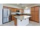 Kitchen with island, stainless steel appliances, and wood cabinets at 4435 Lavender Ln, Pahrump, NV 89061