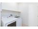 Laundry room with Samsung washer and dryer, shelving at 4435 Lavender Ln, Pahrump, NV 89061