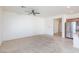 Living room with tile and carpeted floors, open to kitchen at 4435 Lavender Ln, Pahrump, NV 89061