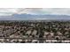 Aerial view of neighborhood with Red Rock Canyon in the distance at 4527 Buddy Holly Ct, North Las Vegas, NV 89031