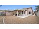 Backyard view showing patio, shed, and gravel landscaping at 4527 Buddy Holly Ct, North Las Vegas, NV 89031