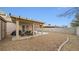 Large backyard with gravel and covered patio at 4527 Buddy Holly Ct, North Las Vegas, NV 89031