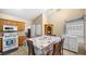 Kitchen features wood cabinets and a dining table at 4527 Buddy Holly Ct, North Las Vegas, NV 89031