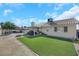 Artificial turf backyard with patio and grill at 4722 Casa Bonita Dr, North Las Vegas, NV 89032