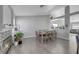 Bright dining room featuring a large table and hardwood floors at 4722 Casa Bonita Dr, North Las Vegas, NV 89032