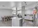 Open concept kitchen with island, stainless steel appliances, and a dining area at 4722 Casa Bonita Dr, North Las Vegas, NV 89032