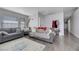 Cozy living room featuring gray sofas and a light gray rug at 4722 Casa Bonita Dr, North Las Vegas, NV 89032