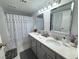 Bathroom with double vanity and a shower/tub combo at 4750 Obannon Dr # D, Las Vegas, NV 89102