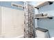 Clean bathroom with shower/tub combo and shelving at 4826 Polar Lights Ct, Las Vegas, NV 89130