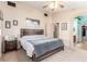 Main bedroom with ceiling fan and access to bathroom at 4826 Polar Lights Ct, Las Vegas, NV 89130