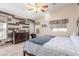 Spacious bedroom with wood-look floors and ceiling fan at 4826 Polar Lights Ct, Las Vegas, NV 89130