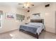 Large bedroom with ceiling fan and wood-look floors at 4826 Polar Lights Ct, Las Vegas, NV 89130