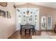 Bright dining area with a table and chairs, near the back door at 4826 Polar Lights Ct, Las Vegas, NV 89130