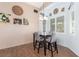 Bright dining area with a table and chairs, near the back door at 4826 Polar Lights Ct, Las Vegas, NV 89130