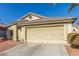 Single-story house with attached garage and desert landscaping at 4826 Polar Lights Ct, Las Vegas, NV 89130