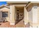 Covered entryway with a front door and small sitting area at 4826 Polar Lights Ct, Las Vegas, NV 89130