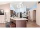 Modern kitchen with dark cabinetry and a breakfast bar at 4826 Polar Lights Ct, Las Vegas, NV 89130