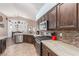 Open kitchen featuring stainless steel appliances and an island at 4826 Polar Lights Ct, Las Vegas, NV 89130