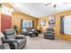 Living room with gray recliners, neutral walls and a cozy atmosphere at 4826 Polar Lights Ct, Las Vegas, NV 89130