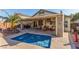 Private backyard with a sparkling pool and relaxing patio cover at 4826 Polar Lights Ct, Las Vegas, NV 89130