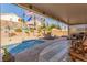 Covered patio overlooks a sparkling pool, perfect for outdoor entertaining at 4826 Polar Lights Ct, Las Vegas, NV 89130