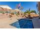 Inviting pool area with a landscaped backyard featuring desert plants at 4826 Polar Lights Ct, Las Vegas, NV 89130