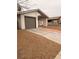 House exterior featuring a single-car garage and a gravel driveway at 4928 Nellie Springs Ct, Las Vegas, NV 89110