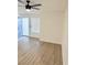 Bright living room with light flooring and a ceiling fan at 4928 Nellie Springs Ct, Las Vegas, NV 89110