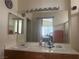 Bathroom with double sinks, large mirror, and a shower/tub combo at 5005 Prairie Springs Ct, Las Vegas, NV 89130