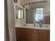 Bathroom with double sinks, large mirror, and a shower/tub combo at 5005 Prairie Springs Ct, Las Vegas, NV 89130