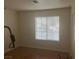 Simple bedroom with wood-look floors and a large window at 5005 Prairie Springs Ct, Las Vegas, NV 89130