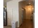 Bright hallway with wood flooring and access to other rooms at 5005 Prairie Springs Ct, Las Vegas, NV 89130