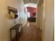 Hallway with wood-look floors leading to living room at 5005 Prairie Springs Ct, Las Vegas, NV 89130