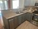 Kitchen with granite countertops and stainless steel appliances at 5005 Prairie Springs Ct, Las Vegas, NV 89130