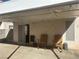 Covered patio with two rocking chairs at 5005 Prairie Springs Ct, Las Vegas, NV 89130