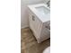 White vanity with modern hardware and quartz countertop at 5006 S Rainbow Blvd # 103, Las Vegas, NV 89118