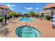 Community pool and spa with plenty of lounge chairs at 5006 S Rainbow Blvd # 103, Las Vegas, NV 89118