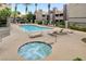 Relaxing pool and spa area with lounge chairs at 5006 S Rainbow Blvd # 103, Las Vegas, NV 89118