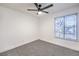 Bright bedroom with ceiling fan and plush carpeting at 5101 Village Dr, Las Vegas, NV 89142