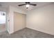 Bedroom with double sliding doors and ceiling fan at 5101 Village Dr, Las Vegas, NV 89142