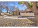 Front view of the house, showing a walkway and landscaping at 5101 Village Dr, Las Vegas, NV 89142