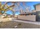 Side view of the house with a walkway and landscaping at 5101 Village Dr, Las Vegas, NV 89142