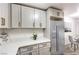 Modern kitchen with white cabinets and quartz countertops at 5101 Village Dr, Las Vegas, NV 89142